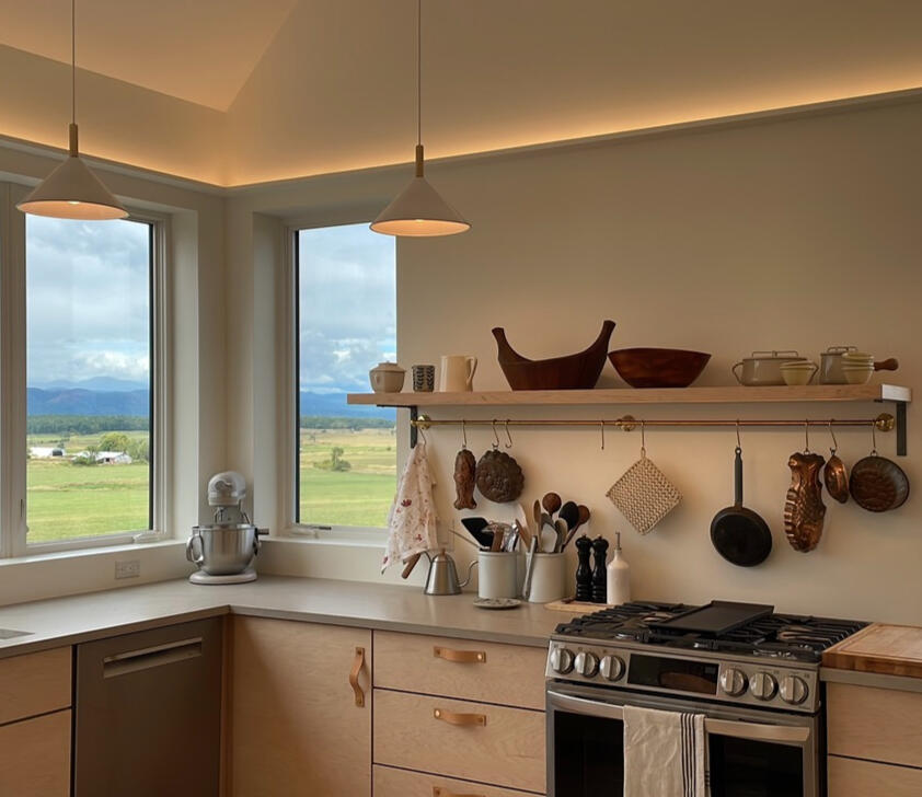 Warm-dim LED tapes in flat coves throughout. Also under-shelf lighting for tasks.
