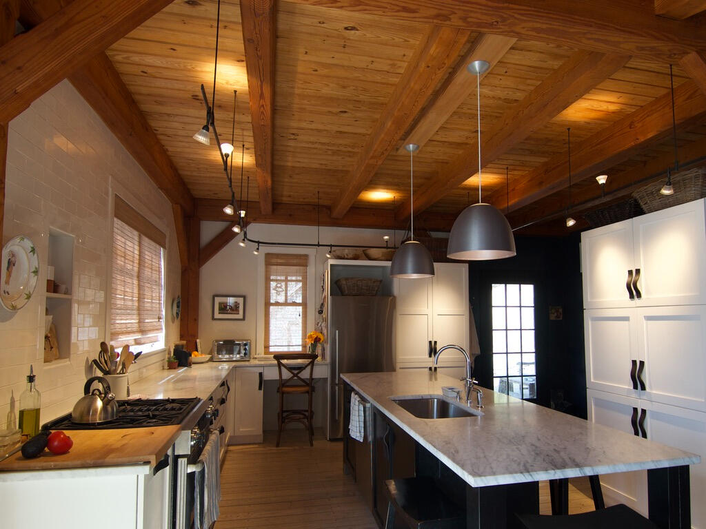Kitchen After - LED rail lighting, up (ambient) & down (tasks) spots on separate dimmers, LED pendants over the island. Plus we unified the south facing glazing.